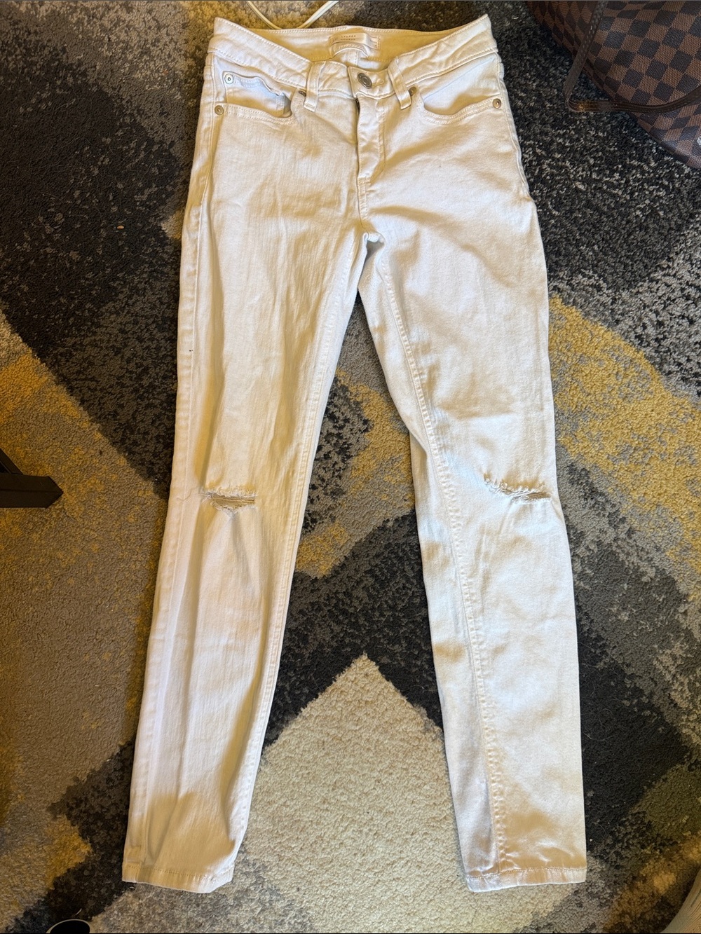 LC Lauren Conrad White Skinny Jeans with Light Knee Distress